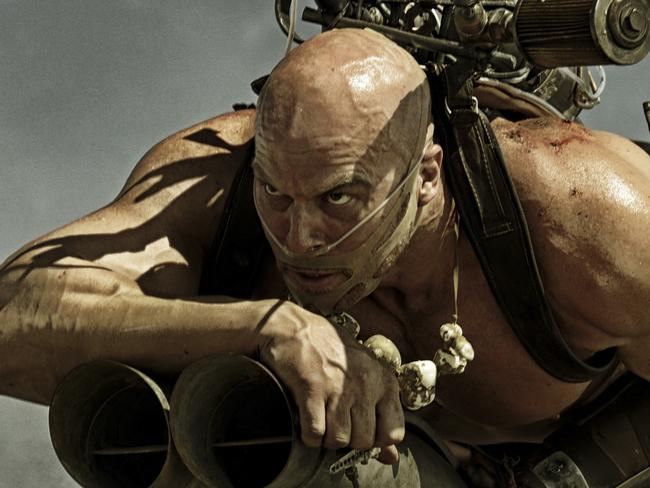 Nathan Jones as Rictus Erectus in a scene from film Mad Max: Fury Road, with Nicholas Hoult driving car