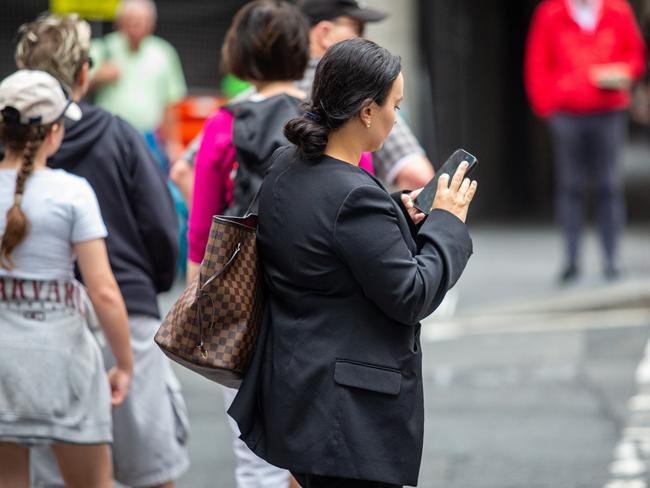 SYDNEY, AUSTRALIA - NewsWire Photos February 06, 2024:  A generic photograph of people on their phone in Sydney.Picture: NCA NewsWire / Christian Gilles