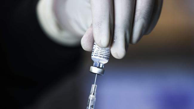 A pharmacy technician prepares a doses of the Pfizer-BioNTech vaccine. Picture: Michael Ciaglo/Getty Images/AFP