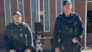 Senior Constable Brett Tome Sergeant Nathan Hester with Police Dogs Cannon and Mace.