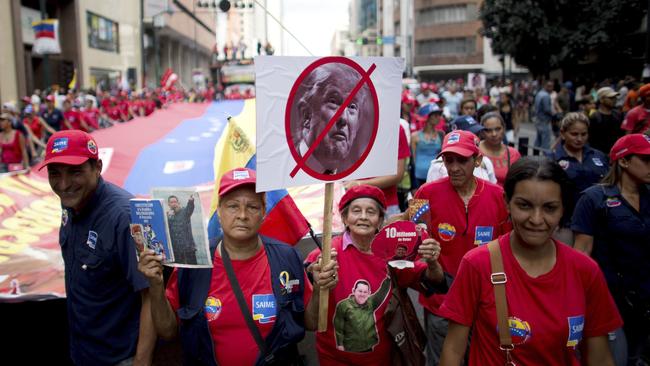 Government supporters take to the streets in Caracas to slam President Trump after he denounced President Maduro’s rule. Picture: Ariana Cubillos