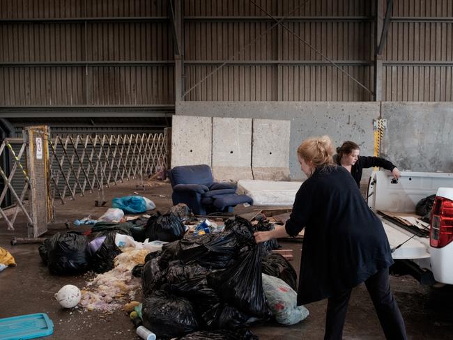 Port Lincoln worker Jamie Lee-Ferguson from the Boston Hotel throws out thousands of dollars worth of spoiled food from the lack of power that hit all local businesses hard. Picture: Robert Lang