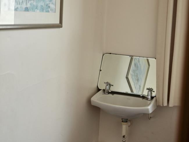 A drab bathroom at the Royal Standard Hotel before the renovation. Picture: Airbnb