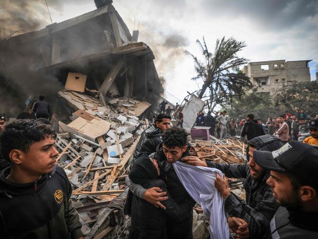 Palestinians react following an Israeli bombardment in the southern Gaza Strip. Picture: Mahmud Hams/AFP