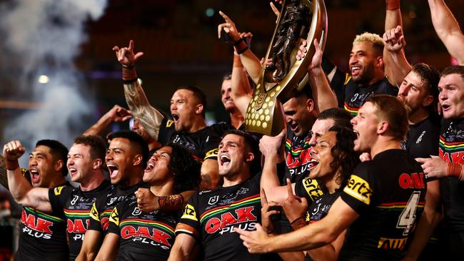 BRISBANE, AUSTRALIA – OCTOBER 03: The Panthers celebrate with the NRL Premiership Trophy after victory in the 2021 NRL Grand Final match between the Penrith Panthers and the South Sydney Rabbitohs at Suncorp Stadium on October 03, 2021, in Brisbane, Australia. (Photo by Chris Hyde/Getty Images)