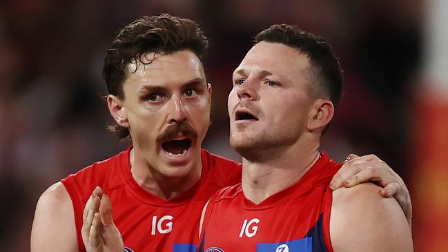 MELBOURNE, AUSTRALIA - August 18, 2023. AFL .   Jake Lever talks with Steven May in the 4th qtr during the semi final match between Melbourne and Carlton at the MCG in Melbourne, Australia.  Photo by Michael Klein.