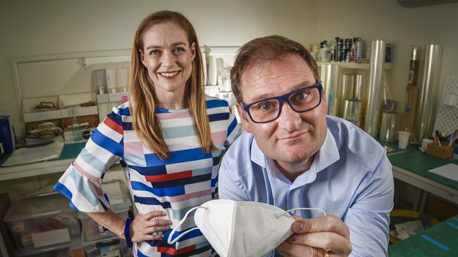 Detmold director Sascha Detmold Cox and CEO Alf Ianniello with a surgical mask the company is about to begin manufacturing. Picture: Roy VanDerVegt