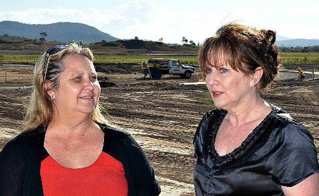 Julie Tudman and Sally Richards on a 1099sq m block at Explorer Estate, Bucasia which has just gone under contract for $244,000. Picture: Peter Holt