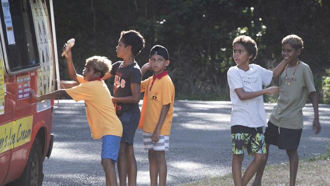 Children line up for their free vaccination ice cream during a three-day doorknocking campaign in Yarrabah. Picture: Brian Cassey