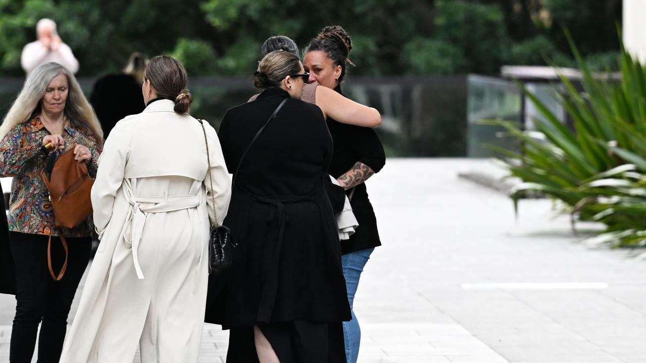 The family embraced outside court but did not comment to the media as they left.Picture: Dan Peled / NewsWire