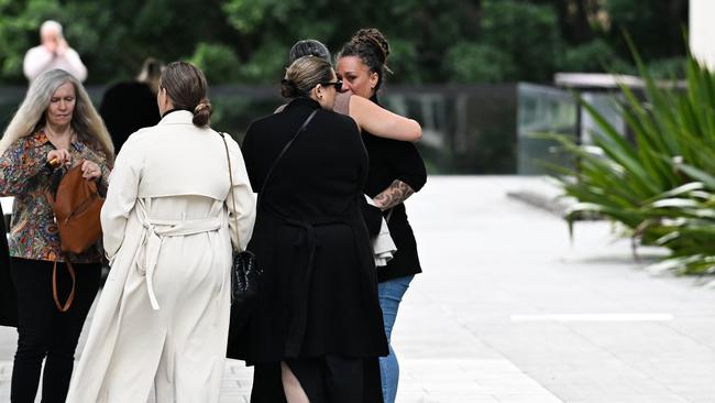 The family embraced outside court but did not comment to the media as they left.Picture: Dan Peled / NewsWire
