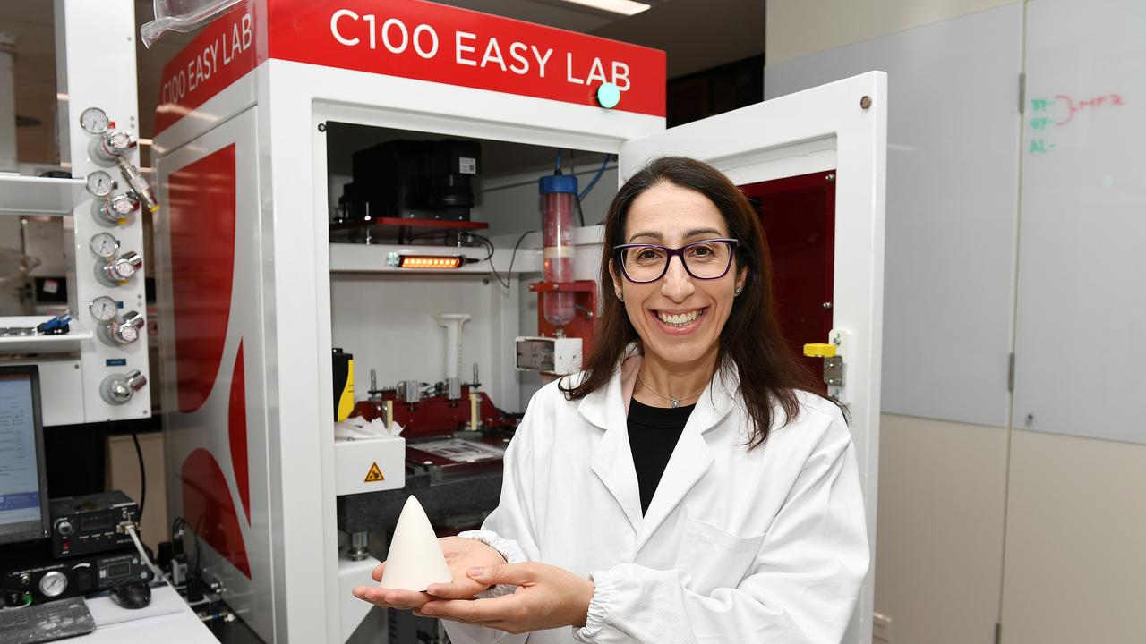 JCU Senior Lecturer in Mechanical Engineering Dr Elsa Antunes with a ceramic 3D printer inside the Advanced Materials and Manufacturing Lab at the new Engineering and Innovation Place building. Picture: Shae Beplate.