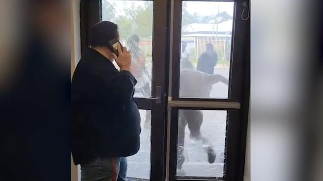 Locals barricaded themselves in the Todd Tavern in Alice Springs as rioters threw bricks, smashed windows and hurled themselves at the locked entrance. Pictures - Supplied