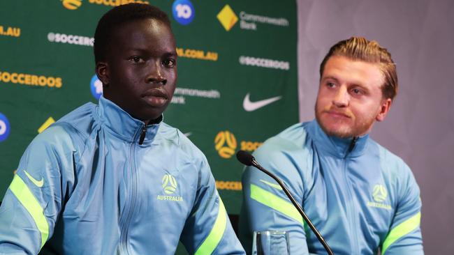 SYDNEY, AUSTRALIA - SEPTEMBER 14: Players Garang Kuol and Jason Cummings speak with the media during a Socceroos squad announcement and press conference at Dexus Place on September 14, 2022 in Sydney, Australia. (Photo by Lisa Maree Williams/Getty Images)