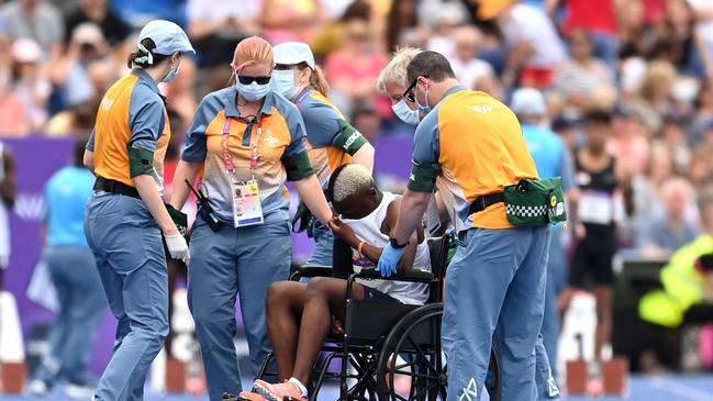 Ayanda Malaza of Team Eswatini is wheeled off the track