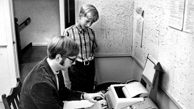 Bill Gates (standing) with Microsoft co-founder Paul Allen. in 1968.