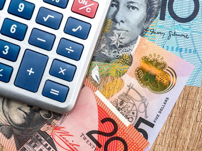 Australian dollar calculator on a wooden table. Generic money, investing, Australian notes