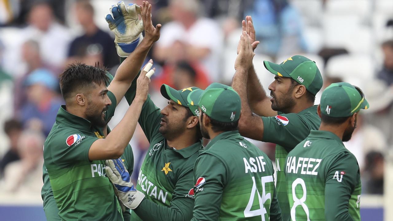 Pakistan celebrate their win over England. Photo: Rui Vieira/AP Photo.