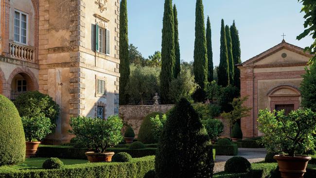 The villa’s classically symmetrical grounds are tamed by five gardeners. Picture: Simon Upton