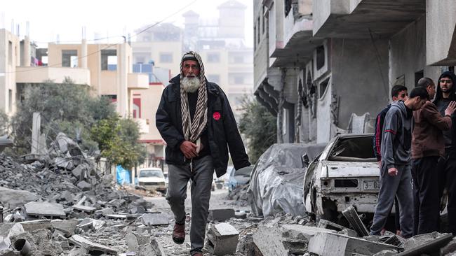 A man finds his way amid the rubble in Deir el-Balah in the central Gaza Strip. Picture: AFP.