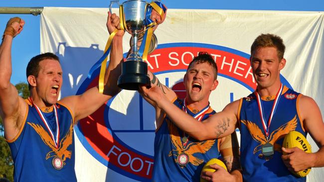 Encounter Bay legend Tyson Neale (right) celebrates the 2013 premiership with Eagles teammates. Picture: Encounter Bay Football Club