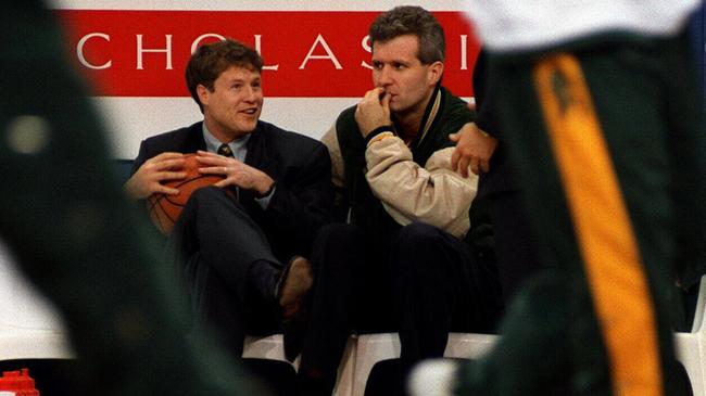 A younger Brett Brown (L), then assistant coach at the Boomers, talks to injured captain Andrew Gaze in 1996.