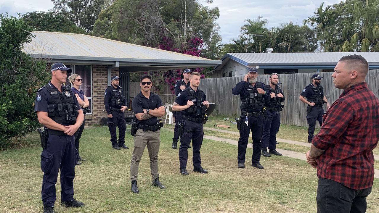 Police stand guard at a Norman Gardens home after a group rallied out front. Picture: Vanessa Jarrett