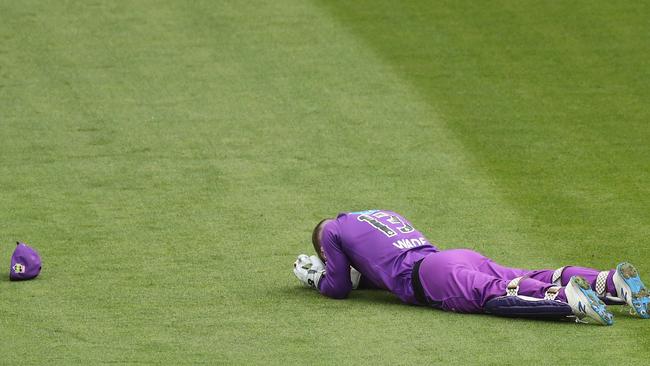 Hurricanes captain Matthew Wade reacts after failing to reach a catch during the Big Bash League match between the Melbourne Renegades and Hobart Hurricanes at Melbourne Cricket Ground, on January 26, 2021, in Melbourne, Australia. (Photo by Mike Owen/Getty Images)