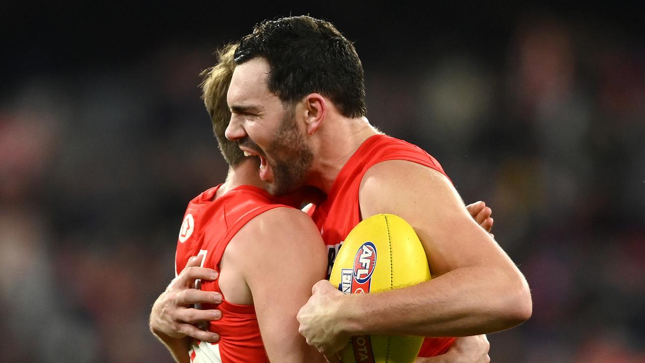 MELBOURNE, AUSTRALIA - SEPTEMBER 02: Dane Rampe and Paddy McCartin of the Swans celebrate winning the AFL Second Qualifying Final match between the Melbourne Demons and the Sydney Swans at Melbourne Cricket Ground on September 02, 2022 in Melbourne, Australia. (Photo by Quinn Rooney/Getty Images)