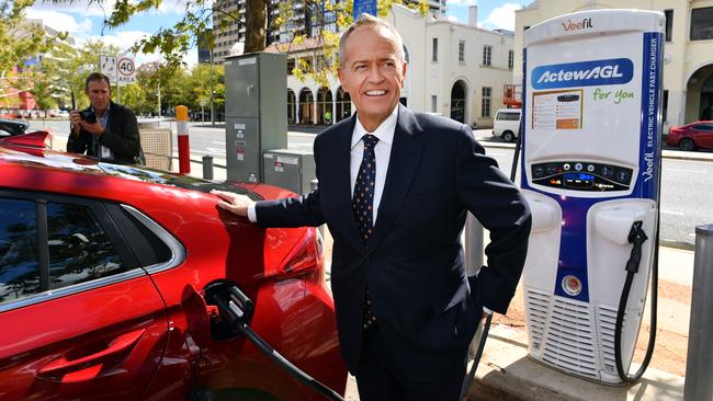 Bill Shorten charges an electric car after launching Labor’s Climate Change Action Plan at the ActewAGL electric car charging station in Canberra on Monday. Picture: AAP