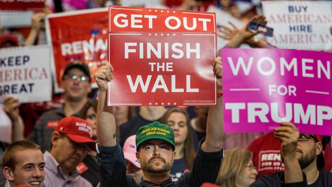 A supporter holds up a placard as US President Donald Trump and his daughter Ivanka Trump deliver remarks at a Make America Great Again rally in Cleveland, Ohio in November, 2018. Picture: AFP