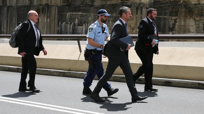 Detectives leave the residence of Alan Jones on Monday. Picture: Gaye Gerard/NewsWire