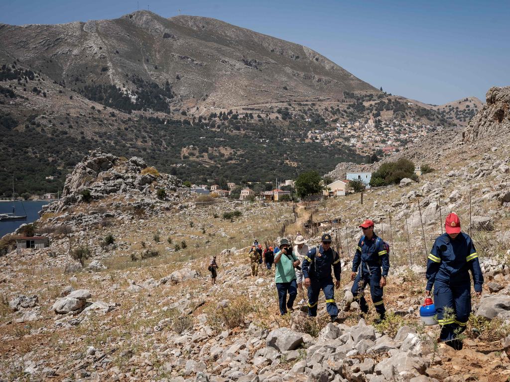 Firefighters take part in a search and rescue operation for Michael Mosley a day after he went missing on the Aegean island of Symi. Picture: AFP