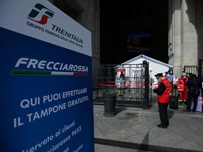 Passengers wait to be tested before boarding a Milan – Rome train. Picture: AFP.