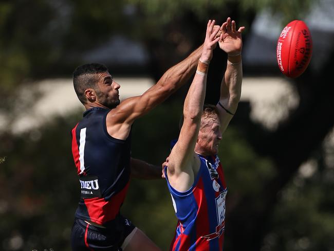 Adam Saad climbs above a Port Melbourne opponent to spoil.