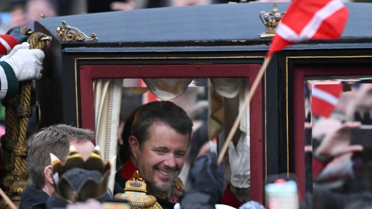 King Frederik X of Denmark rides in a carriage with Queen Mary of Denmark (not seen) escorted by the Guard Hussar Regiment's Mounted Squadron to Amalienborg in Copenhagen. Picture: AFP