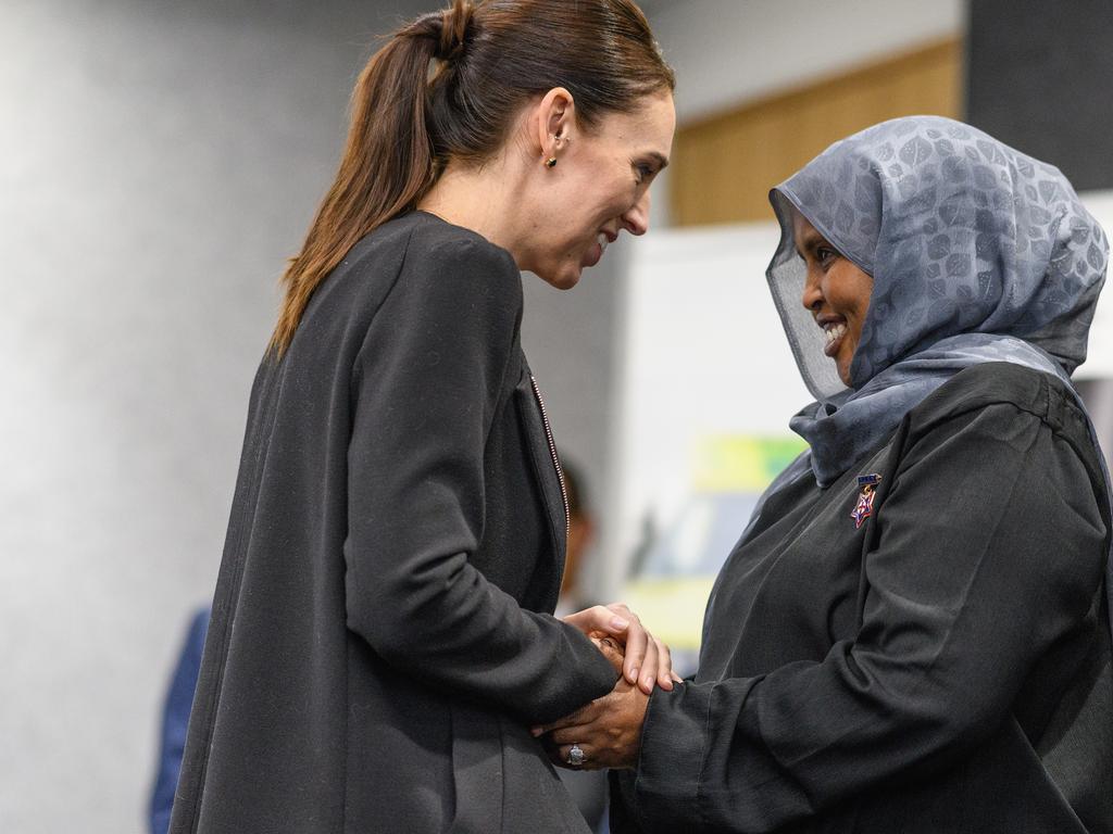 Jacinda Ardern greets a first responder after Friday’s massacre. Picture: Kai Schwoerer/Getty Images