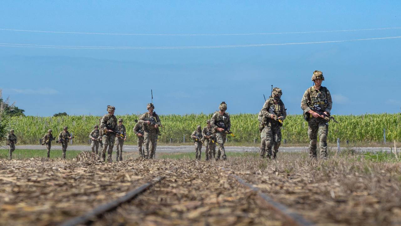 British Royal Marine Commandos patrol past sugar cane fields in Ingham, Queensland, during Exercise Talisman Sabre 2021. Picture: Department of Defence