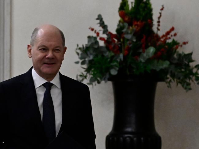 German Chancellor Olaf Scholz enters the presidential Bellevue Palace to meet with the German President and ask him to dissolve the parliament after the vote of confidence against him, in Berlin on December 16, 2024. Germany's embattled Chancellor Olaf Scholz faces parliament on December 16, 2024 to trigger the process towards February 23, 2025 elections, in the hope that he can weather a political crisis and win a second term. (Photo by John MACDOUGALL / POOL / AFP)