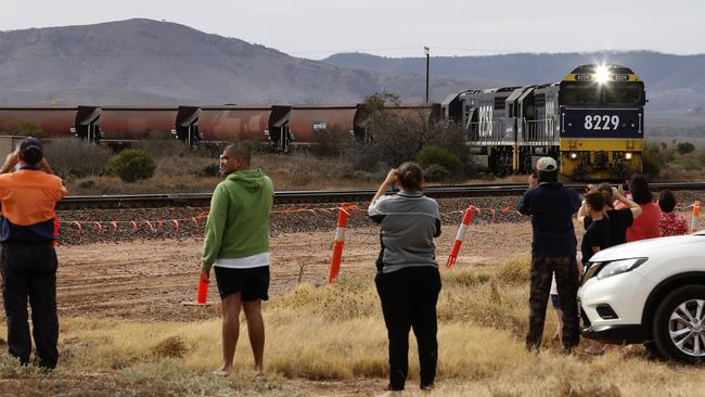 Community residents turn out to watch the final coal train heading from Leigh Creek to the soon-to-be-closed Port Augusta power station. Picture: Dean Martin