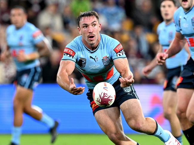BRISBANE, AUSTRALIA - JUNE 21: Reece Robson of New South Wales passes the ball during game two of the State of Origin series between the Queensland Maroons and the New South Wales Blues at Suncorp Stadium on June 21, 2023 in Brisbane, Australia. (Photo by Bradley Kanaris/Getty Images)