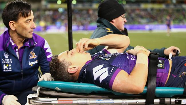 Billy Slater is taken from the field after a tackle by Iosia Soliola. Picture: Getty Images