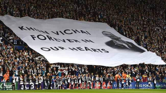 Leicester fans observe a minute’s silence to remember Vichai Srivaddhanaprabha and the other victims of the crash. Picture: AFP