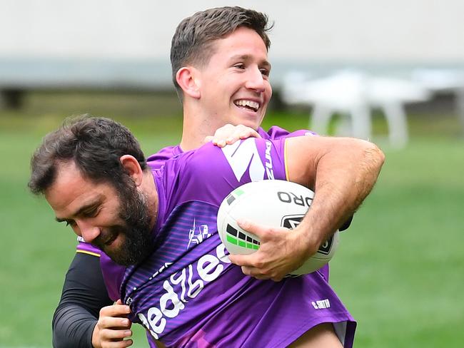 MELBOURNE, AUSTRALIA - MAY 19: Cameron Smith of the Storm is tackled by Cooper Johns during a Melbourne Storm NRL training session at AAMI Park on May 19, 2020 in Melbourne, Australia. (Photo by Quinn Rooney/Getty Images)