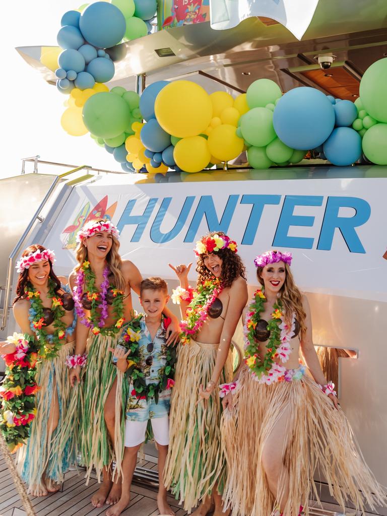 As guests arrived, Hula dancers placed leis around their necks. Picture: Jessica McDonald