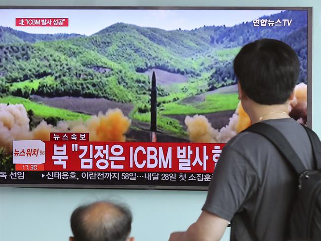 People watch local TV news showing what was said to be the launch of a Hwasong-14 intercontinental ballistic missile by North Korea. Picture: AP