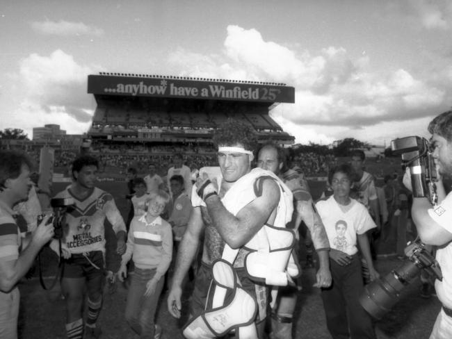 Souths player John Elias (centre) leaves the field after the 1985 semi-final win over Brothers at Lang Park.