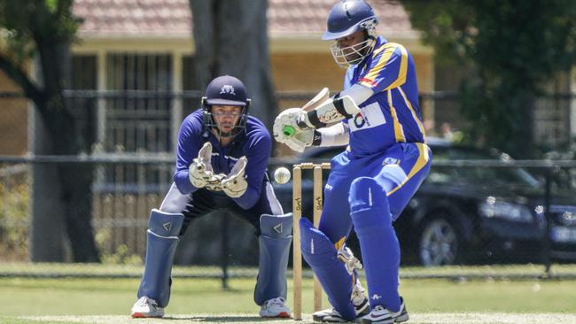 VSDCA: Mt Waverley keeper Ben Hocking and Noble Park batter Achintha Rajapakse. Picture: Valeriu Campan