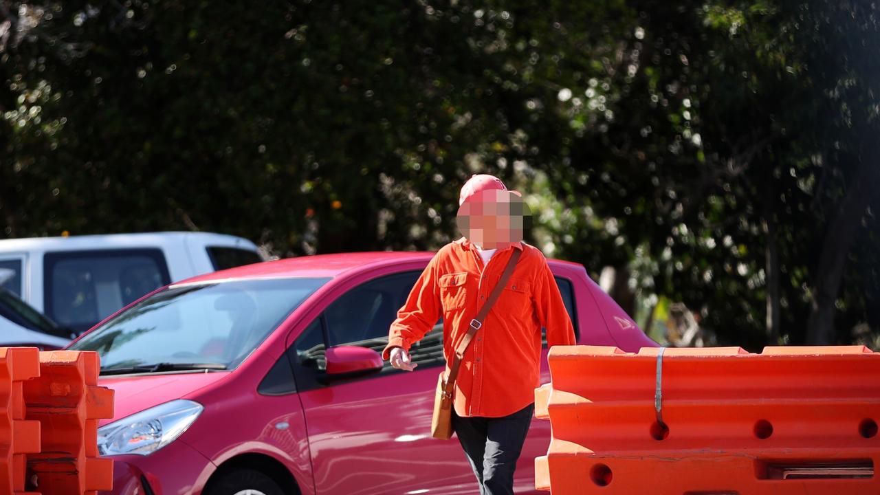 A man prepares to walk across the border at Tweed Heads.