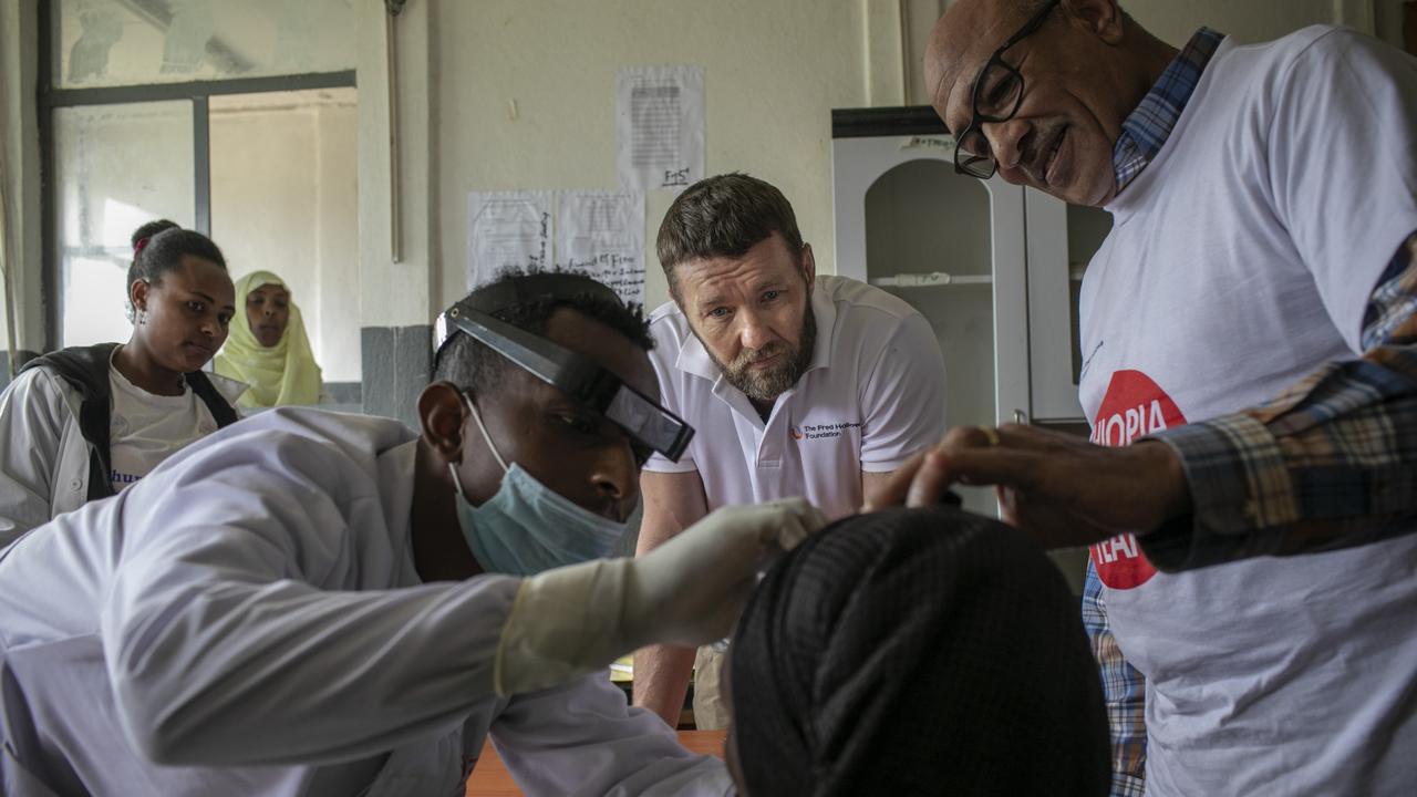 The moment Hawiti’s patch is removed, 24 hours after her successful trachoma surgery. Picture: Michael Amendolia/Fred Hollows Foundation